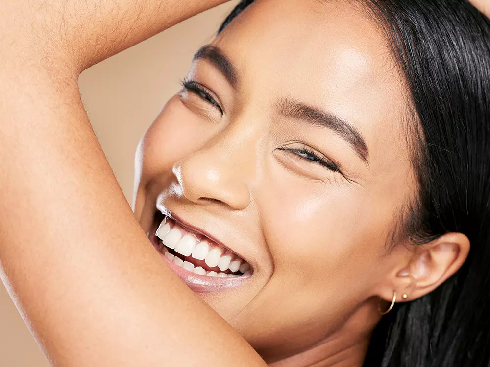 Smiling Asian Woman with Porcelain Veneers