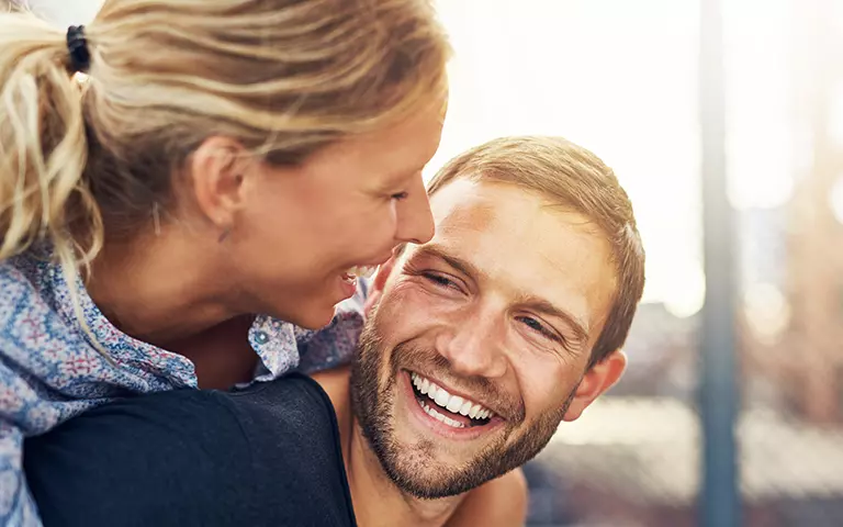 Smiling Couple with Beautiful Smiles from Cosmetic Dentistry